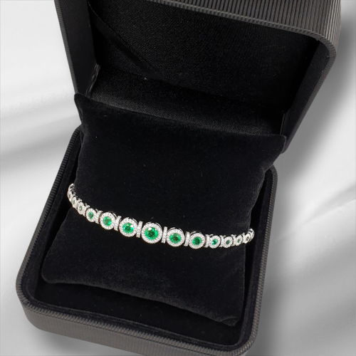 White gold bracelet with emeralds and diamonds